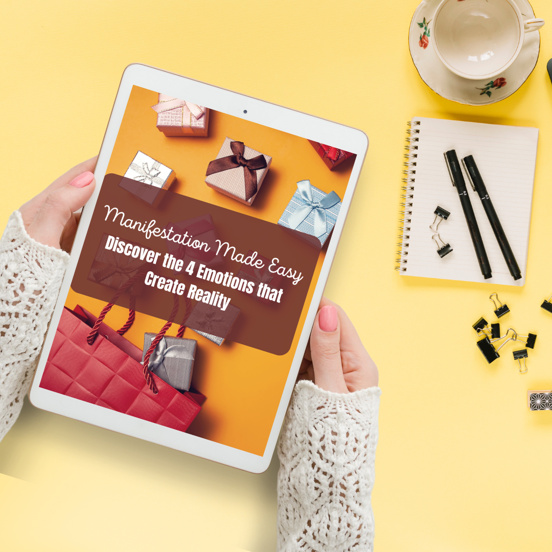 Person holding a tablet with a book cover on a yellow background that represents a digital guide titled " Manifestation made easy. Discover he 4 emotions that create reality " and you can get it at laiamunozauthor.com