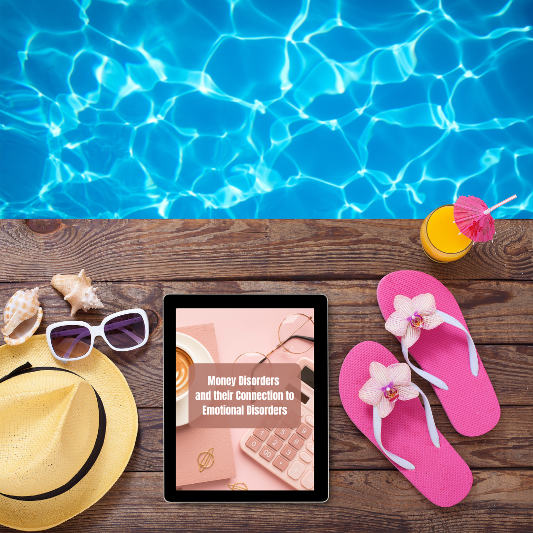 Tablet with a book cover displayed on a wooden table by a poolside with flip-flops, sunglasses, and a hat that features an ebook about money mindset