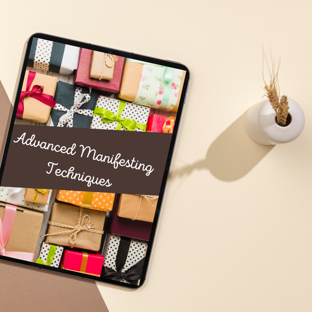 Tablet displaying 'Advanced Manifesting Techniques' with gift boxes on a beige surface that features a digital book titled " Advanced Manifesting Techniques " and you can get it at laiamunozauthor.com