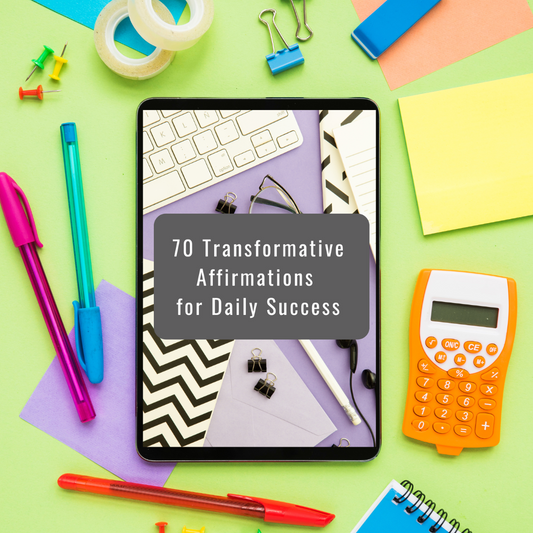 Tablet displaying '70 Transformative Affirmations for Daily Success' surrounded by stationery items on a colorful background that represents an ebook and you can get it at laiamunozauthor.com