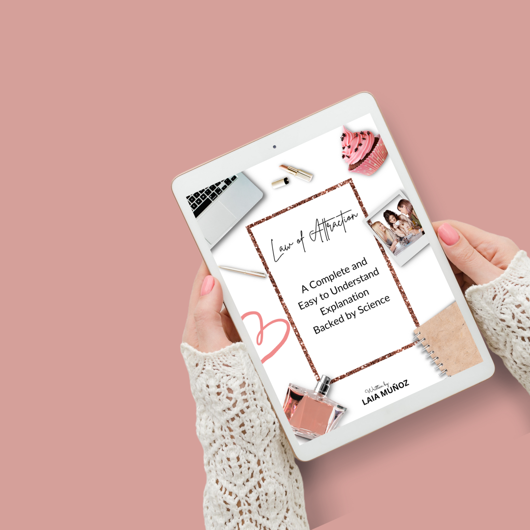 hands holding a tablet featuring a digital book called law of attraction explanation and you can buy it at laiamunozauthor.com