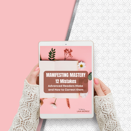 A person holding a tablet displaying the cover of the ebook 'Manifesting Mastery. 12 Mistakes Advanced Readers Make and How to Correct Them' by Laia Munoz and you can buy it at laiamunozauthor.com