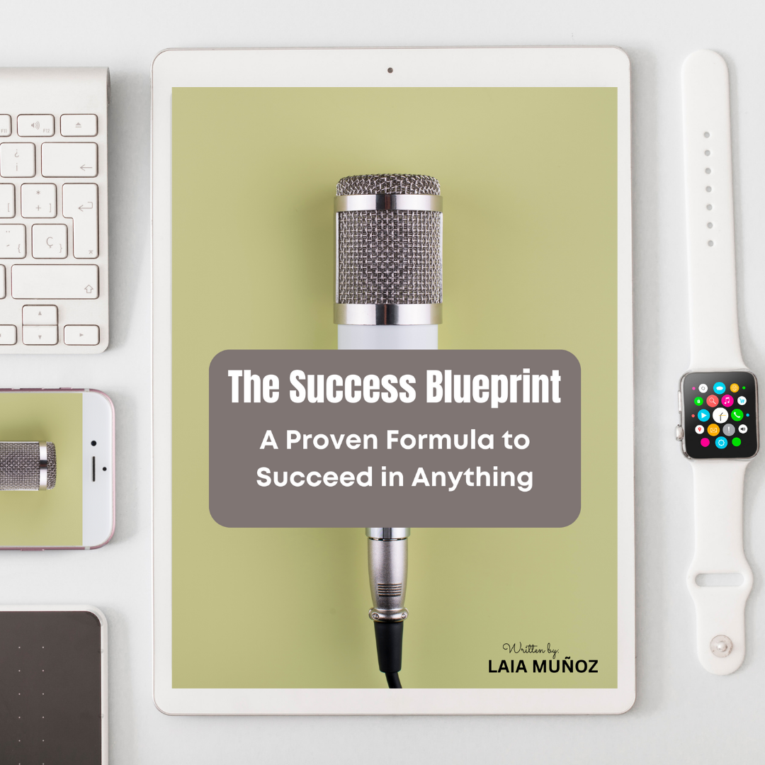 a watch and a phone with a tablet featuring a digital book titled " the success blueprint "