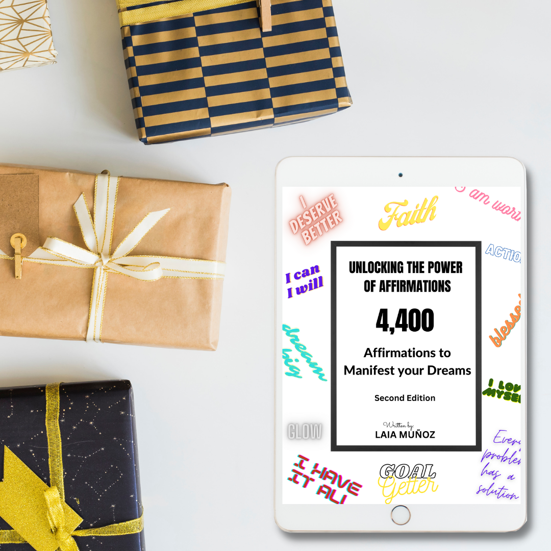 tablet with gifts around featuring a digital guide titiled " unlocking the power of affirmations " and you can get it at laiamunozauthor.com