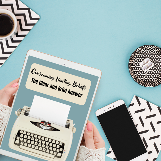 Person holding a tablet with an eBook cover featuring a typewriter on a light blue surface with a phone and coffee cup representing an ebook mockup of a book titled " Overcoming limiting beliefs. the clear and brief answer "and you can buy it at laiamunozauthor.com