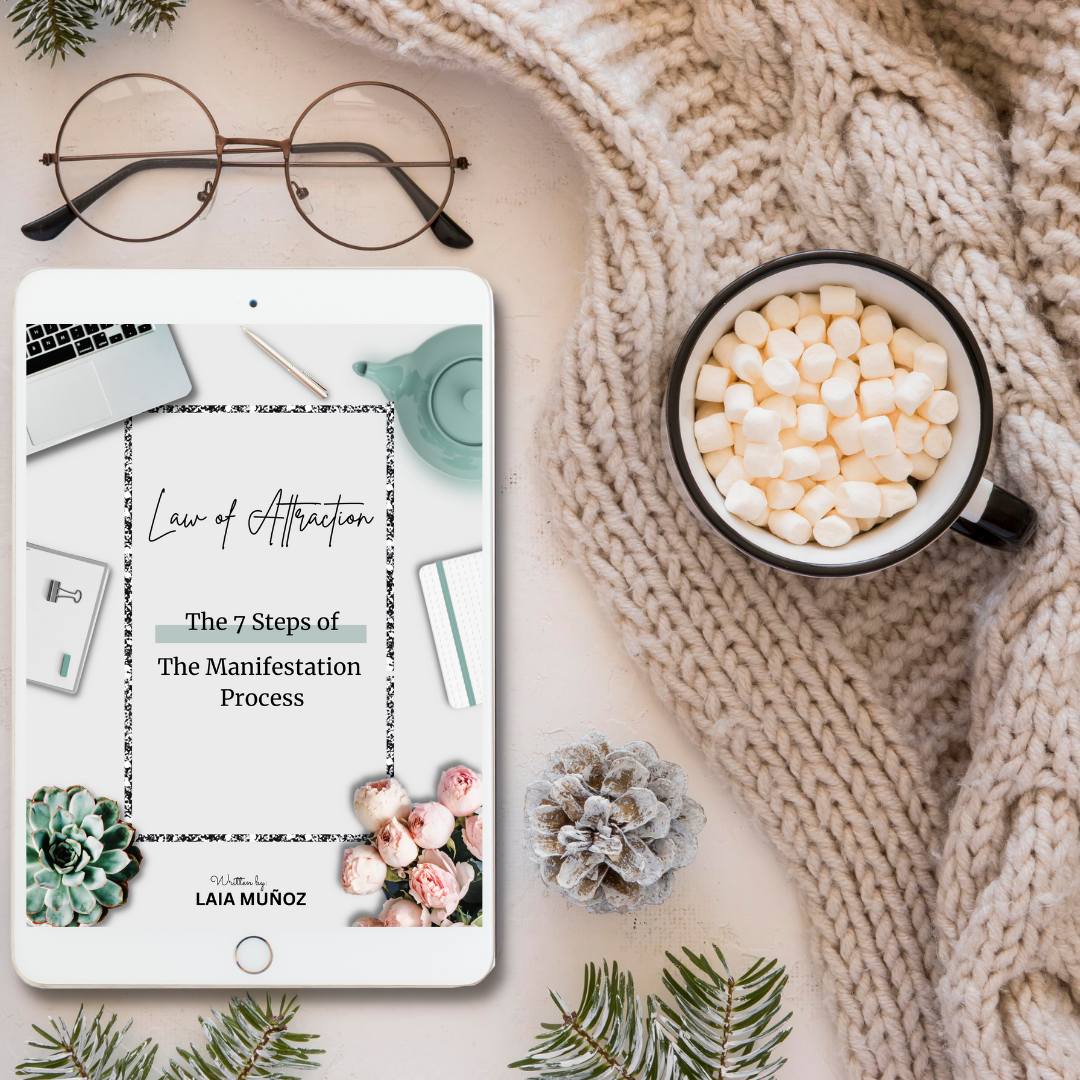 a cozy sweater and a tablet featuring the digital book Manifestation process and you can buy it at laiamunozauthor.com